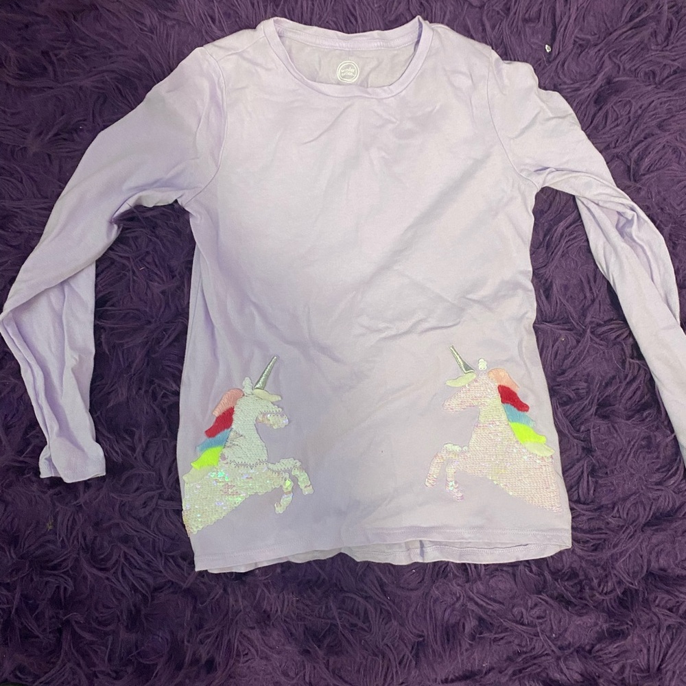 Light purple long sleeve shirt. Super comfy and have unicorns on the bottom.